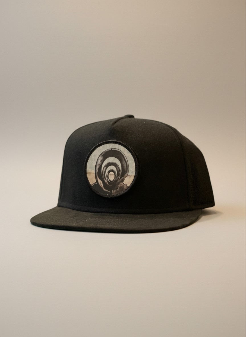 Candace Hunter "Those In-Between" sublimated patch attached to a Blackout Patch & Wear™ Chicago Star snapback hat.
