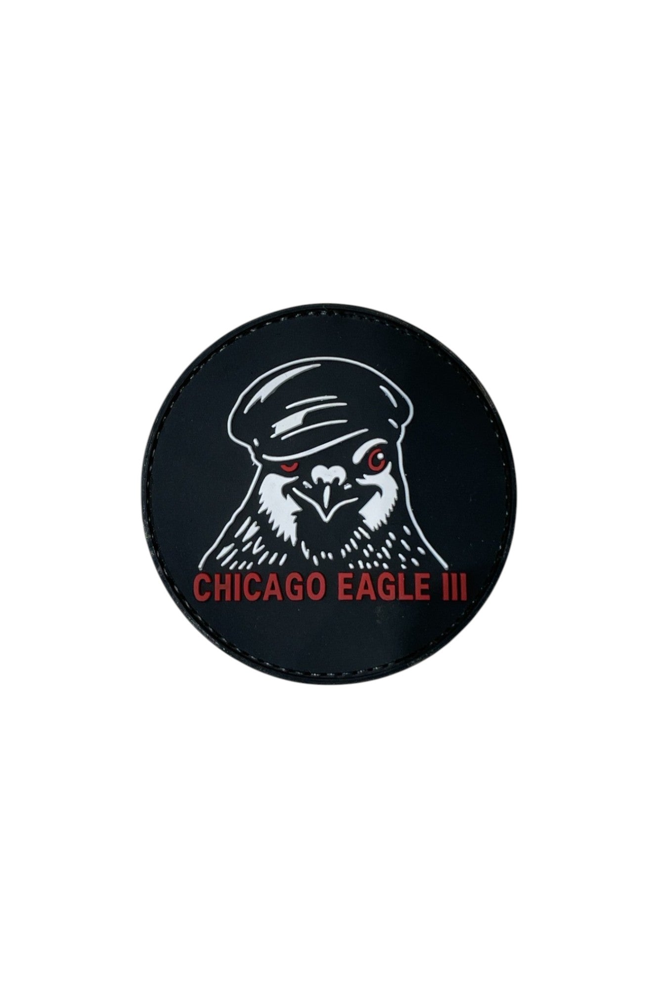 Circular 3D molded PVC Patch & Wear™ accessory featuring the Chicago Eagle III design; durable raised texture with bold black, white, and red details.