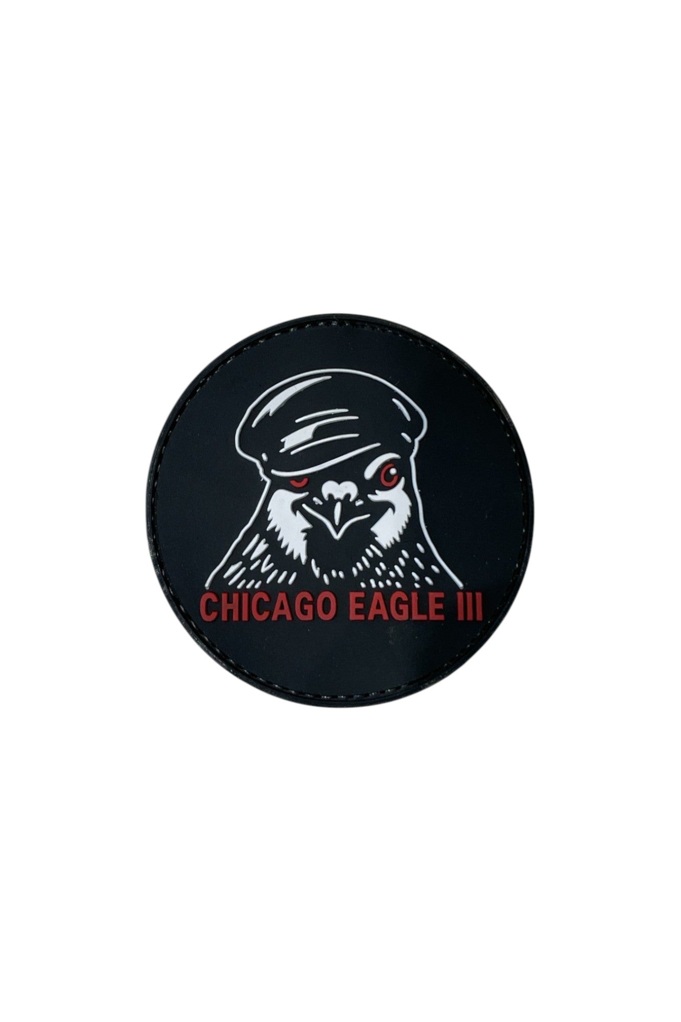 Circular 3D molded PVC Patch & Wear™ accessory featuring the Chicago Eagle III design; durable raised texture with bold black, white, and red details.