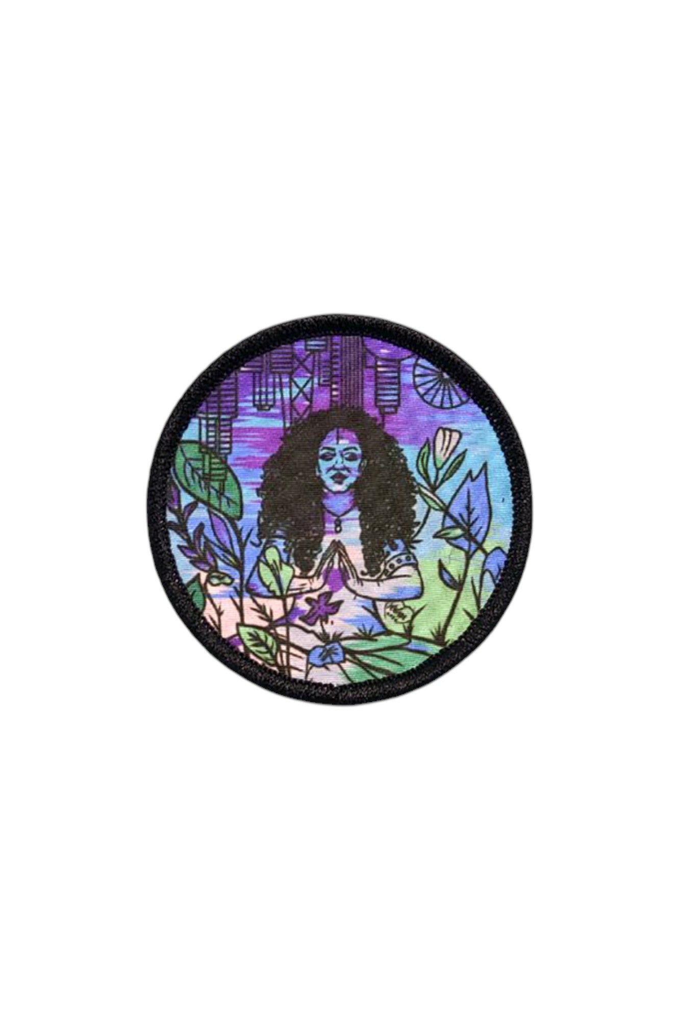 Circular sublimated Patch & Wear™ accessory featuring "All Love" artwork by Martha Wade; vibrant illustration of a woman in a meditative pose with a Chicago skyline backdrop.