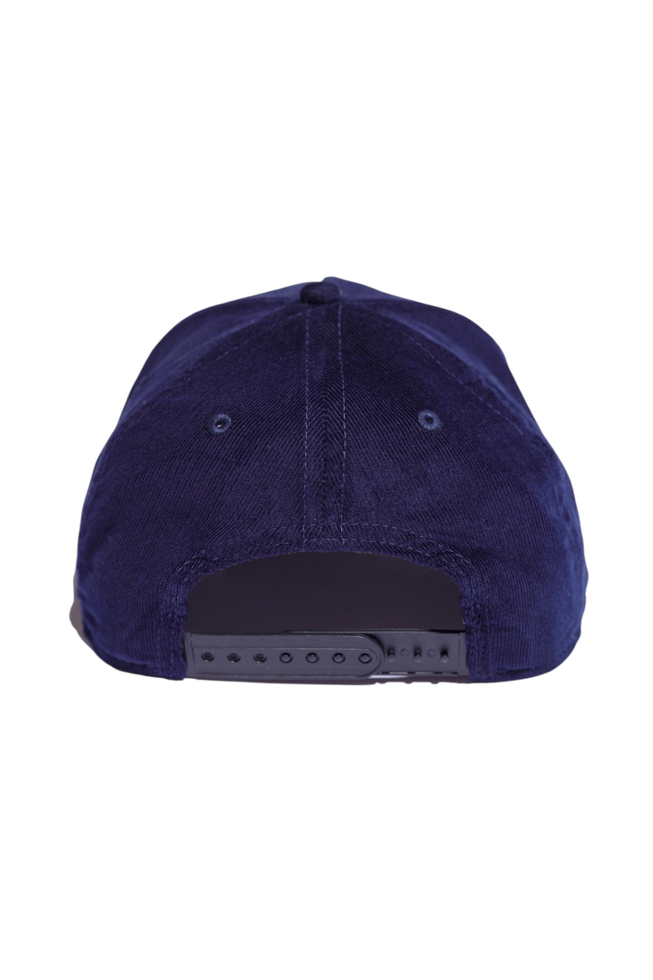 Back view of navy and brown five-panel snapback hat showing adjustable strap and closure.