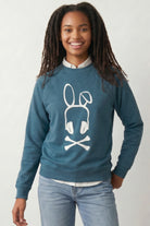On-body fit view of the Mauve Bad Bunny Headphones Raglan Crewneck Sweatshirt, demonstrating the classic silhouette, raglan sleeve construction, and ribbed cuffs.