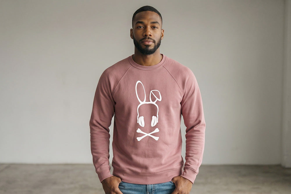 On-body fit view of the Mauve Bad Bunny Headphones Raglan Crewneck Sweatshirt, demonstrating the classic silhouette, raglan sleeve construction, and ribbed cuffs.