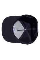 Underneath view of black flannel and suede snapback hat showing the undervisor and interior construction.