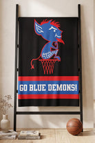DePaul University varsity knit throw blanket  hanging on blanket rack in black, yale blue, red, and white with Billy Blue Demon mascot by SOUNDOFF - front