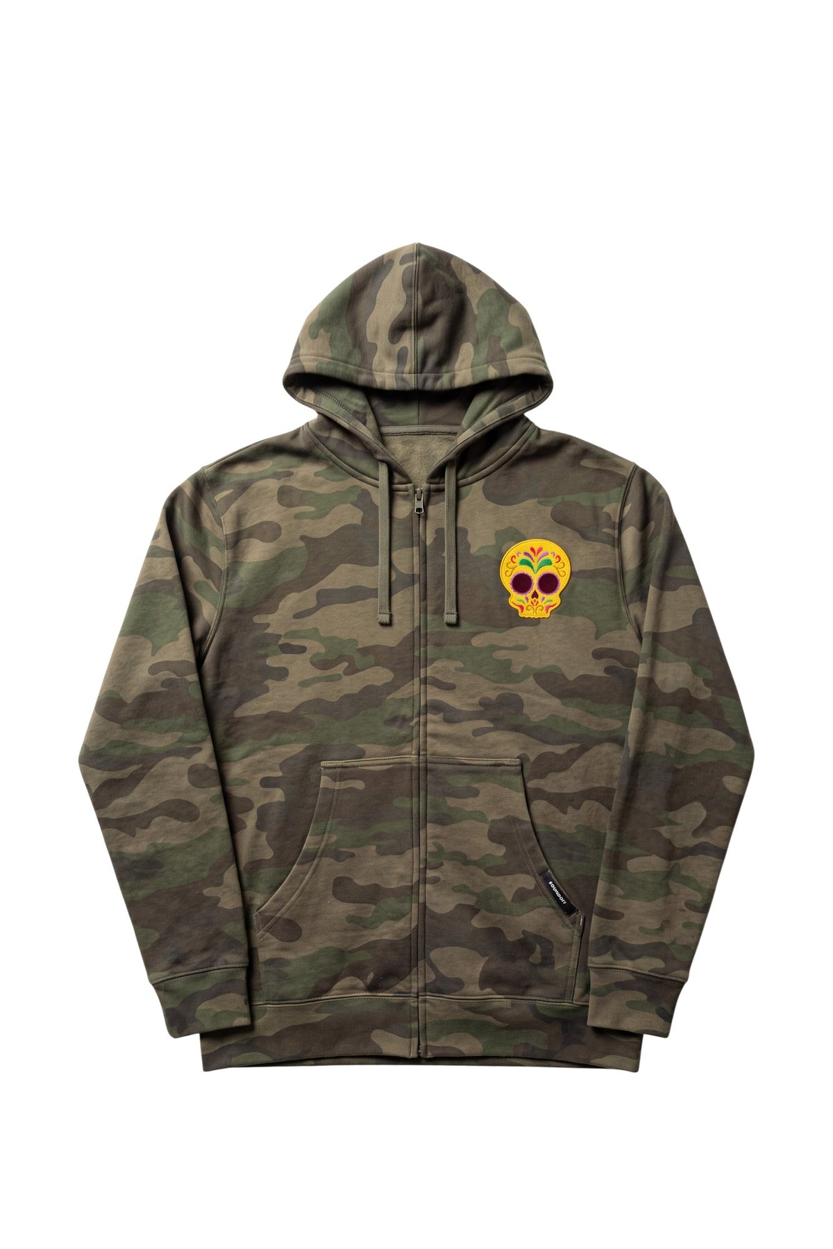 Front view of a forest camouflage zip-front hoodie featuring an intricately detailed goldenrod-colored 3.25-inch embroidered Mexican Sugar Skull patch on the left chest and split kangaroo pockets.