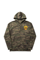 Front view of a forest camouflage zip-front hoodie featuring an intricately detailed goldenrod-colored 3.25-inch embroidered Mexican Sugar Skull patch on the left chest and split kangaroo pockets.