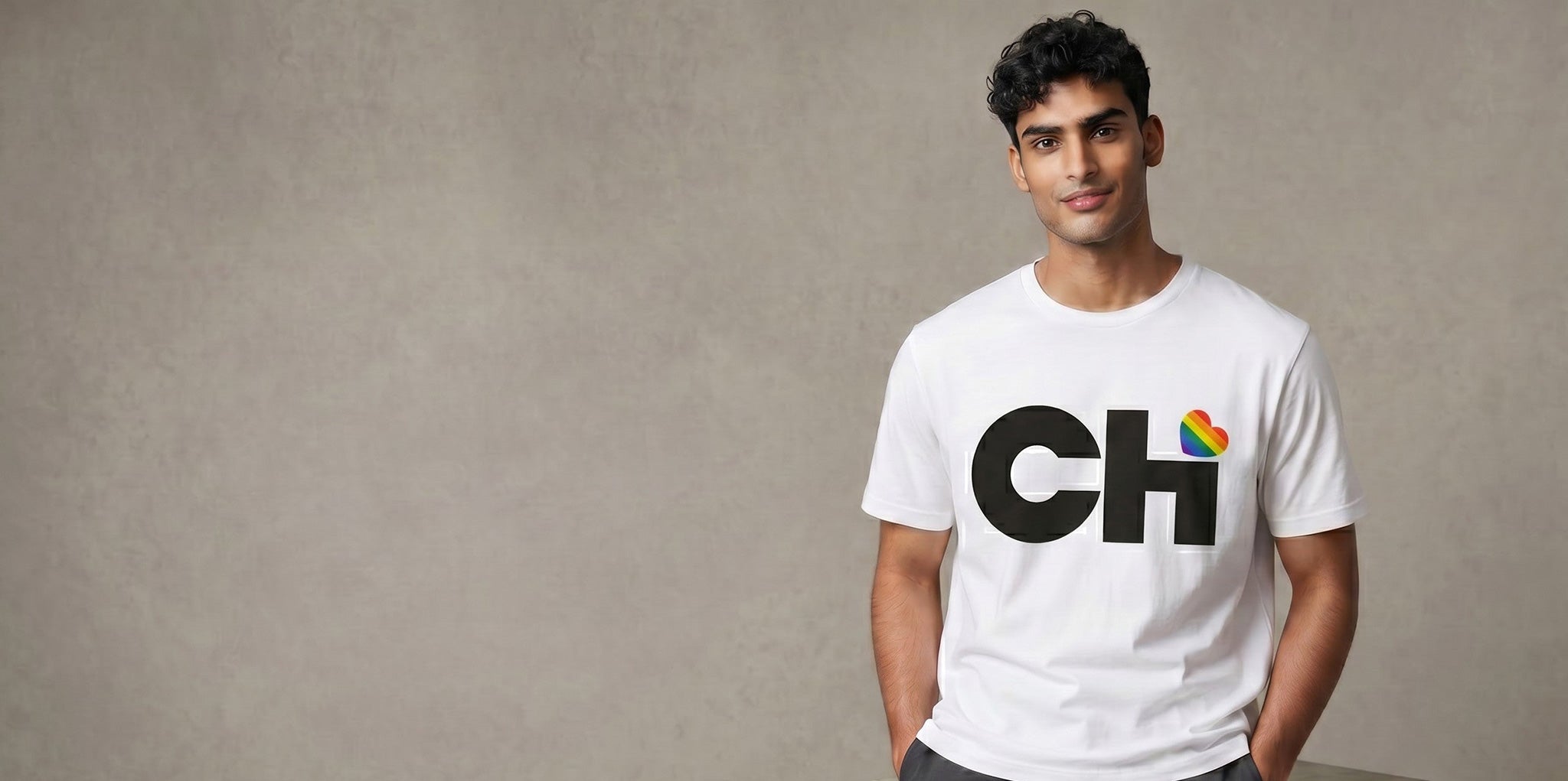 On-body view of the Love Chicago Pride t-shirt in white, featuring a bold black CHi graphic where a rainbow heart dots the I.