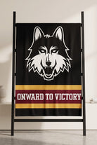 Loyola University Chicago varsity knit throw blanket in black, burgundy, and mustard gold with LUC Wolf head logo by SOUNDOFF - hanging