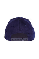 Back view of navy and brown five-panel snapback hat showing adjustable strap and closure.