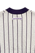 Close up of light grey and purple Northwestern University heritage pinstripe cardigan knit sweater with arched white crest patch with NORTHWESTERN embroidered in purple sewn onto the upper center back below the collar.